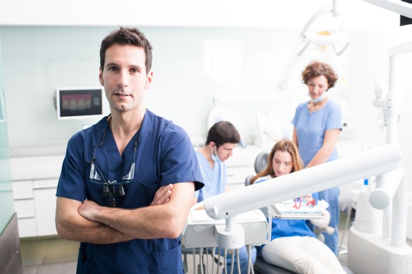 Doctor Giving A Patient A Wisdom Tooth Extraction