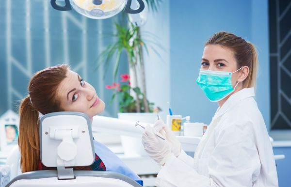 Dental Patient Getting A Dental Cleaning
