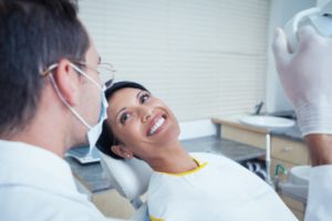 dentist with dental patient.