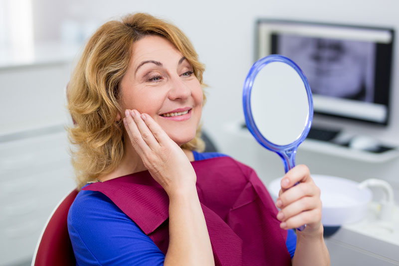 dental implants patient smiling after procedure
