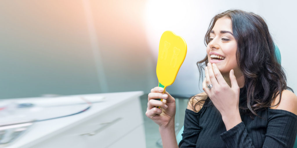 dental patient smiling after pinhole treatment