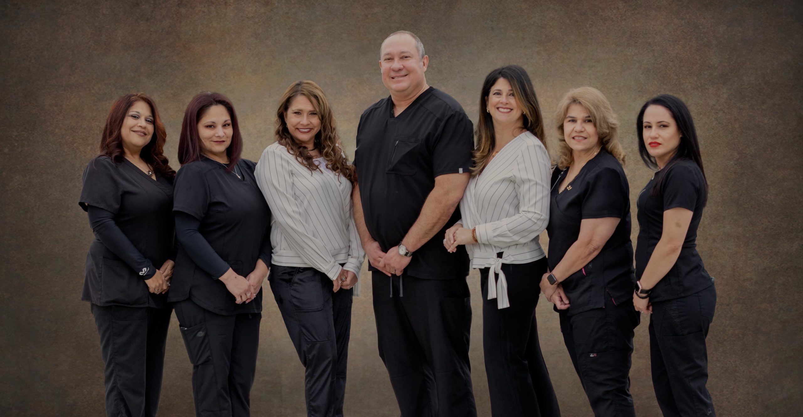preferred dental center team posing for photo